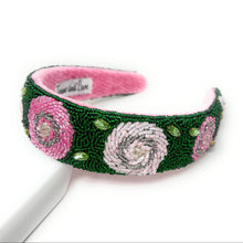Load image into Gallery viewer, Hand-beaded floral headband featuring pink rose motifs, sparkling crystal accents, and rich green beadwork for an elegant garden-inspired look.