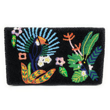 Load image into Gallery viewer, Woman holding a black beaded clutch featuring colorful tropical flowers, lush leaves, and vibrant botanical embroidery on a dark background.