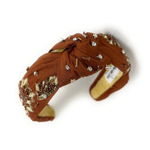 Load image into Gallery viewer, Brown headband with decorative elements on a white background