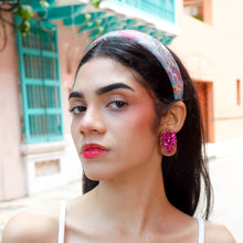 Load image into Gallery viewer,  Elegant pink fancy earrings showcased by a model in a stylish outfit