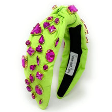 Load image into Gallery viewer, Neon green knotted headband embellished with bold pink gemstones and sparkling rhinestone details.
