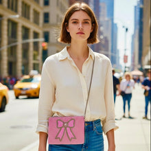 Load image into Gallery viewer, Chic pink beaded zip pouch with bow detail, perfect for accessories or cosmetics.