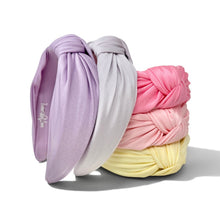 Load image into Gallery viewer, Five twisted fabric headbands in lavender, light gray, pink, and pale yellow, stacked and overlapping on a white background.
