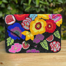 Load image into Gallery viewer, Elegant black beaded envelope bag showcasing bold floral patterns in vivid rainbow-inspired colors.