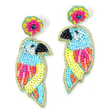 Load image into Gallery viewer, Chic summer fashion portrait showcasing a floral embellished headband and bright handcrafted bird beadwork earrings.