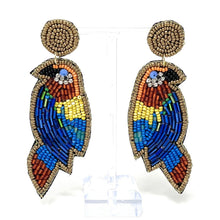 Load image into Gallery viewer, Fashion portrait featuring a bright yellow embellished headband with floral details paired with bold bird-inspired beaded earrings.