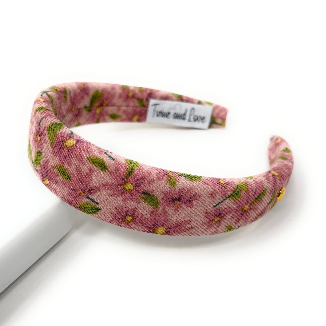 Floral patterned headband on a white background