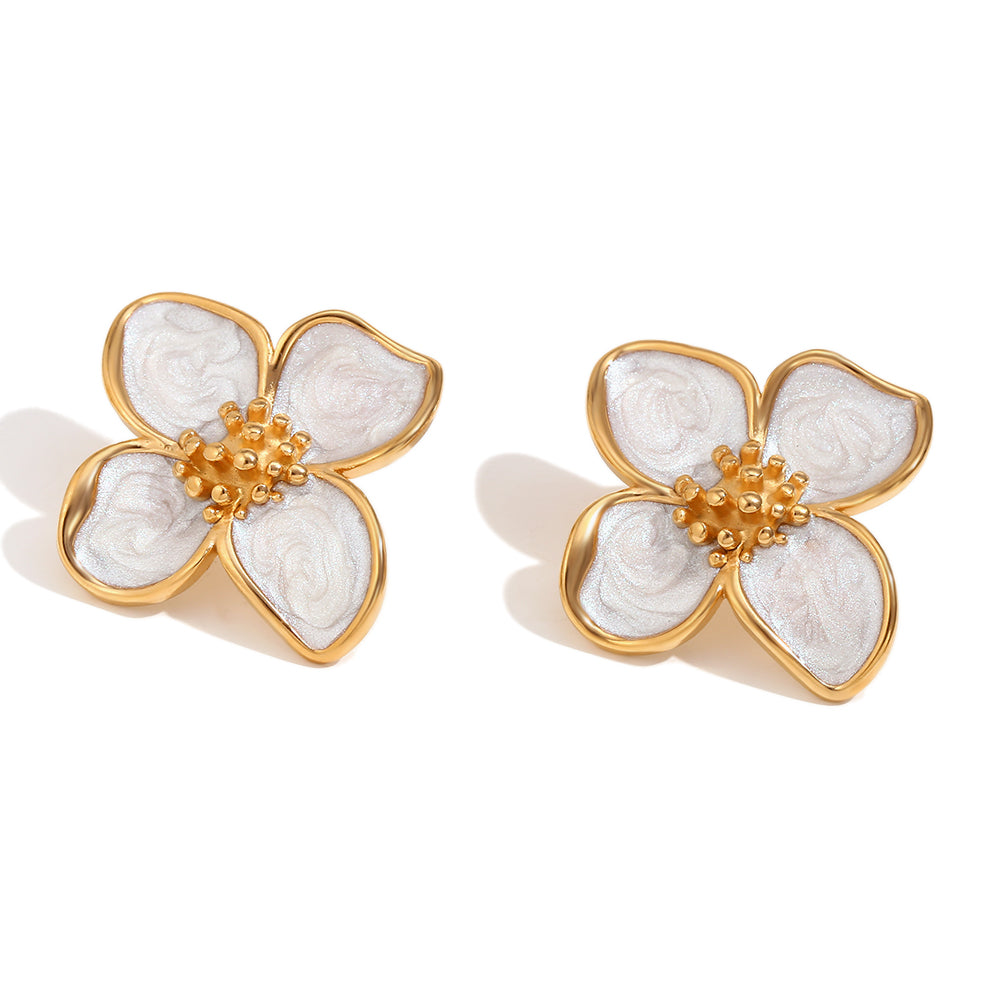 Flower-shaped earrings with 18k gold plated and white design on a white background