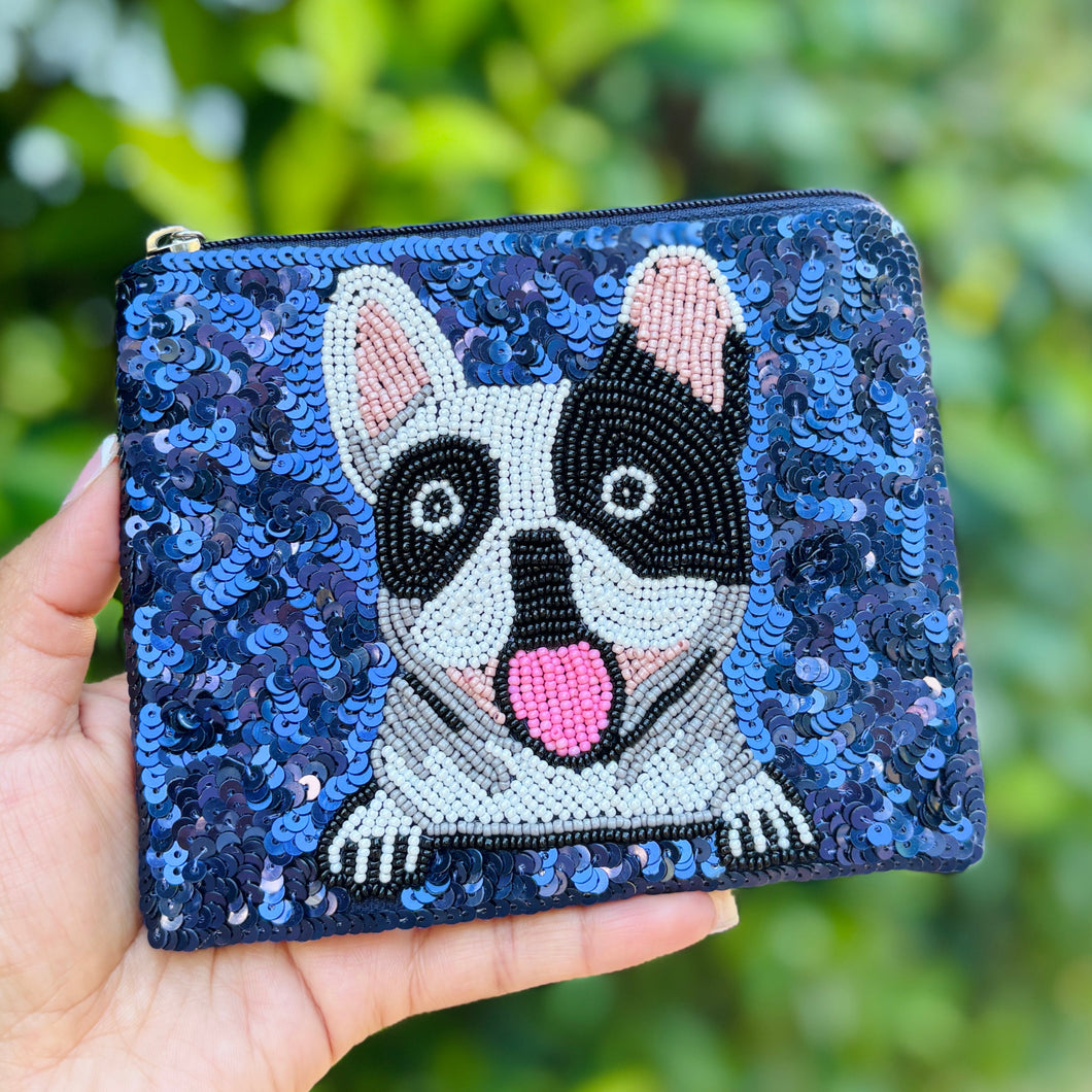 Blue sequin purse with a beaded French bulldog design. The dog has a playful expression and a light pink tongue, adding a fun, cheerful tone.