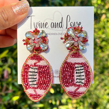Load image into Gallery viewer, Beaded football statement earrings featuring intricate seed bead embroidery and sparkling crystal accents for the ultimate game day look.