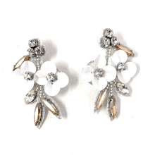 Load image into Gallery viewer, Glamorous white blossom earrings with crystal details and soft champagne stones designed for an elegant and romantic aesthetic.
