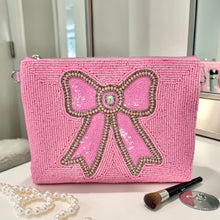 Load image into Gallery viewer, Bright pink mini clutch with intricate beadwork and decorative bow centerpiece.