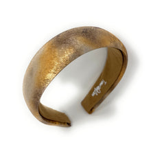 Load image into Gallery viewer, A textured brown headband with metallic gold and copper hues on a white background, conveying a stylish and elegant tone.