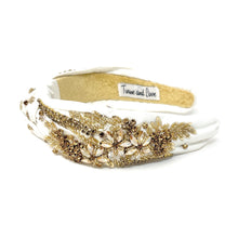 Load image into Gallery viewer, Elegant white headband with gold embellishments and intricate design.