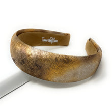 Load image into Gallery viewer, Textured gold and brown headband with a subtle shimmer on a white background, evoking a sense of elegance and style.