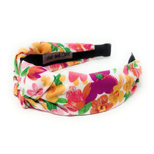 Load image into Gallery viewer, Woman wearing a bright floral print headband and oversized yellow flower earrings for a playful summer look.