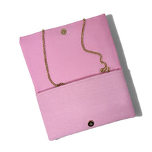 Load image into Gallery viewer, Open pink golf cart beaded clutch showing the pink interior, snap closure, and gold-tone chain strap.