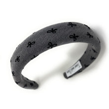 Load image into Gallery viewer, Gray headband with black bow pattern on a white background