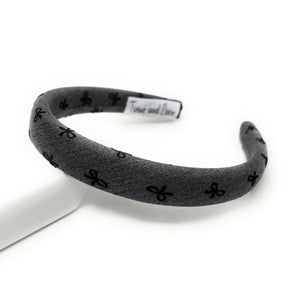 Gray headband with bow black patterns on a white background