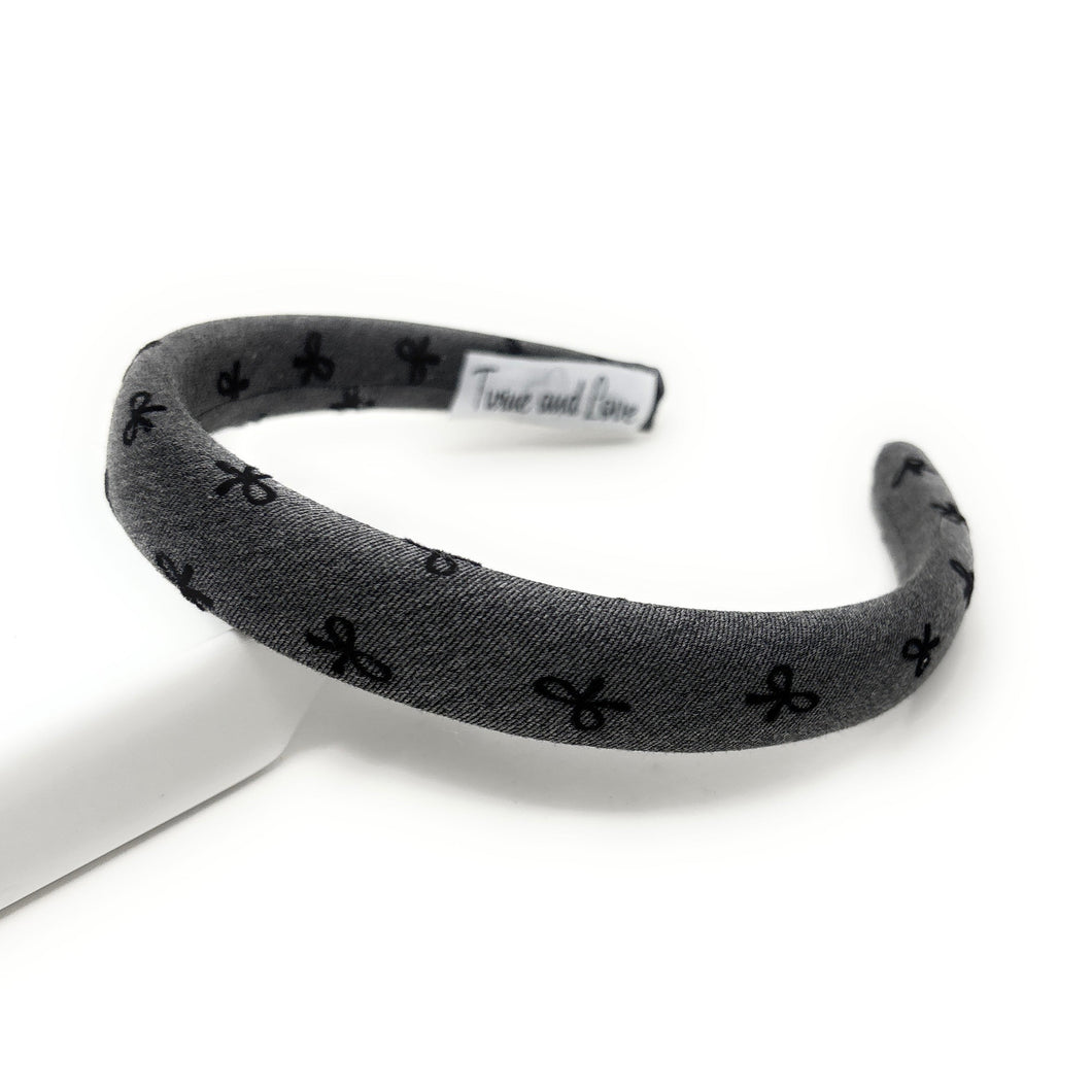 Gray headband with bow black patterns on a white background