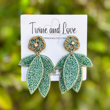 Load image into Gallery viewer, custom beaded Earrings, jeweled Earrings, Green leaves Beaded Earrings, leaves earrings, summer jeweled earrings, handmade earrings, custom earrings, resort accessories, fancy accessories, leaves embellished earrings, custom earrings, best friend gifts, birthday gifts, bohemian earrings, luxurious handmade accessories, party earrings, Fancy earrings, boho earrings, beaded earrings, multicolor embellished earrings, Fancy jeweled earrings, statement earrings, best selling items, statement earrings, handmade 
