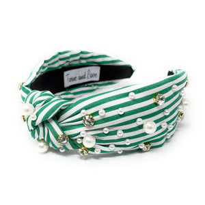 Green and white striped headband with a central knot, adorned with pearls and rhinestones, creating an elegant and playful look.