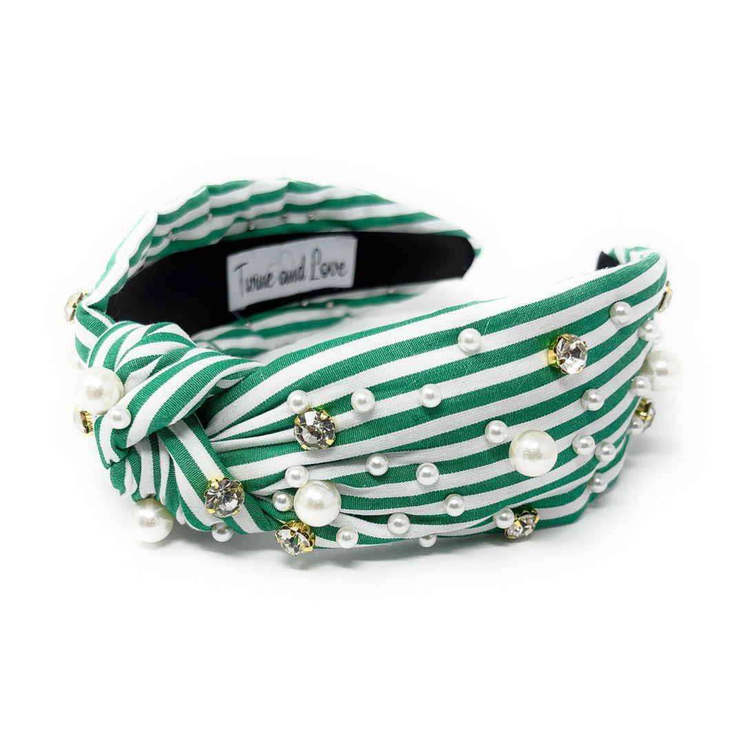 Green and white striped headband with a central knot, adorned with pearls and rhinestones, creating an elegant and playful look.