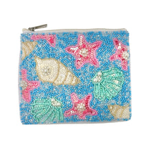 Load image into Gallery viewer, Beaded pouch with a beach theme, featuring colorful starfish and seashell patterns against a blue background. The pouch has a zipper on top.