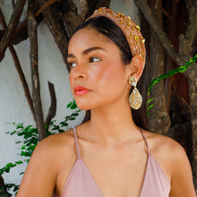 Load image into Gallery viewer, Beautiful handmade gold earrings displayed on a model.
