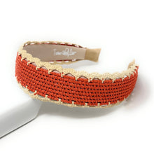 Load image into Gallery viewer, A woven fabric headband in terracotta orange and beige, featuring a scalloped lace trim, displayed on a white stand against a white background.