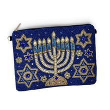 Load image into Gallery viewer, Front view of a navy blue Hanukkah clutch with an intricate gold and crystal menorah design.