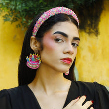 Load image into Gallery viewer, Woman wearing colorful headband and birthday cake earrings against a yellow background