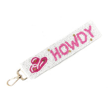 Load image into Gallery viewer, Keychain with 'HOWDY' text and decorative elements on a white background