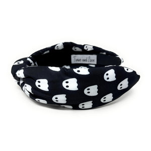 Five Halloween-themed headbands with different patterns: spider webs on black, candy corn, plaid, jack-o'-lanterns on orange, and ghosts on black.