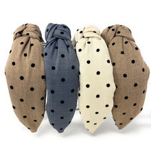Load image into Gallery viewer, Four fabric headbands with black polka dots are arranged in a triangular pattern. They are beige, tan, and charcoal blue, each with a knotted design, conveying a casual, stylish tone.