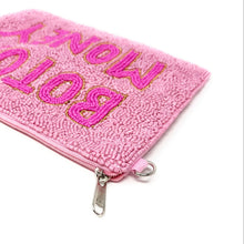 Load image into Gallery viewer, A pink textured zippered pouch featuring the words 'BOTOX MONEY' in pink letters outlined in gold, shown on a plain white background.