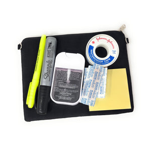 Black pouch with stationery items including a yellow highlighter, black marker, and adhesive tape on a white background (items are not included)