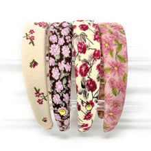 Load image into Gallery viewer, Set of four floral-patterned headbands on a white background