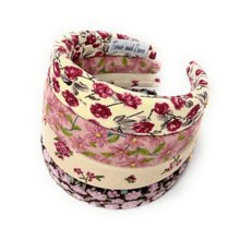 Load image into Gallery viewer, Floral patterned headband on a white background