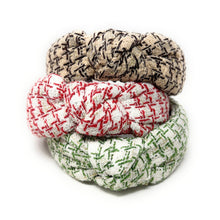 Load image into Gallery viewer, three textured headbands stacked, featuring a woven pattern. The top one has brown beige accents, second one has green accents, and the bottom one showcases red accents on a white background.