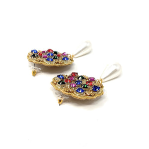 Gold earrings with a scalloped edge, featuring blue, red, green, and purple gemstones. Each earring has a dangling white teardrop pearl, exuding elegance.