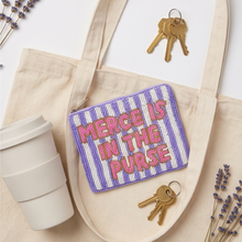 Load image into Gallery viewer, Purple and white striped Merce Is In The Purse hand-beaded pouch with pink lettering.