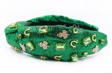 Load image into Gallery viewer, headbands for women, green knotted headband, headband style, top knot headband, green top knot headband, lucky charm jeweled headband, lucky charm hair band, green Jeweled knot headband, St Patrick’s Jeweled headband, top knotted headband, hand bead knotted headband, Clover leaf hair band, St Patrick’s Embellished headband, statement headbands, embellished headband, best selling items, clover leaf knot headband, st paddy’s headband, green hair accessories, four leaf clover headband, shamrock headband