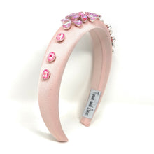 Load image into Gallery viewer, Pink headband with decorative elements on a white background