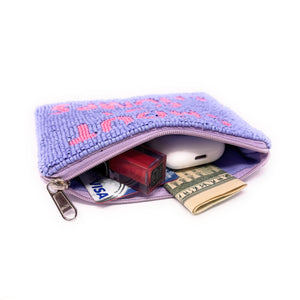A beaded pouch with blue beads and bold pink text reading "SHOUT OUT CHUMPS" on the front. It has a zipper at the top and a playful tone.
