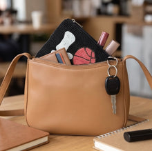 Load image into Gallery viewer, Love Basketball hand-beaded pouch showing its zipper closure and compact design for carrying everyday essentials.