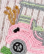 Load image into Gallery viewer, Close-up of a hand-beaded pink golf cart design on a white and green pouch.