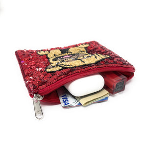Red sequin pouch with a pug design containing cards and a wallet on a white background *Items on the picture are not included*