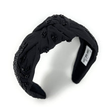 Load image into Gallery viewer, Black headband with decorative elements on a white background