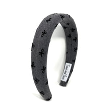 Load image into Gallery viewer, Gray headband with black bow pattern on a white background